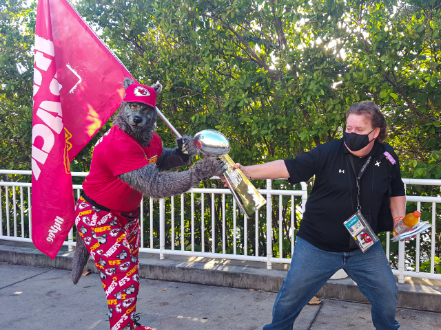 BuccaneersFan Rader battles with Cheifs superfan for control of Super Bowl Trophy.